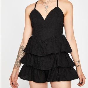 Black ruffle-tiered romper